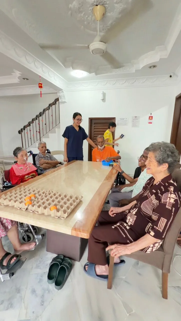 Residents and staff participating in a group activity